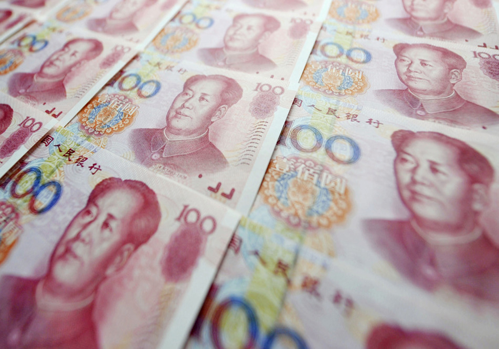 File photo taken in July 2015 shows 100 Chinese yuan bills. China sharply devalued the yuan for a second day on Aug. 12, 2015, with the central bank setting its daily reference rate for the yuan 1.6 percent lower than the previous day at 6.3306 per U.S. dollar, sparking concerns over financial-market volatility and a currency war in Asia. (Kyodo) ==Kyodo